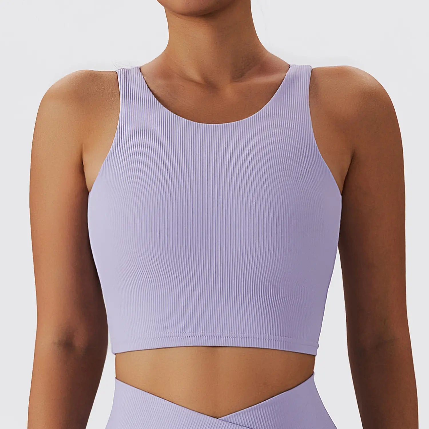 A lavender ribbed quick dry breathable running sports bra with a round neckline and seamless construction.