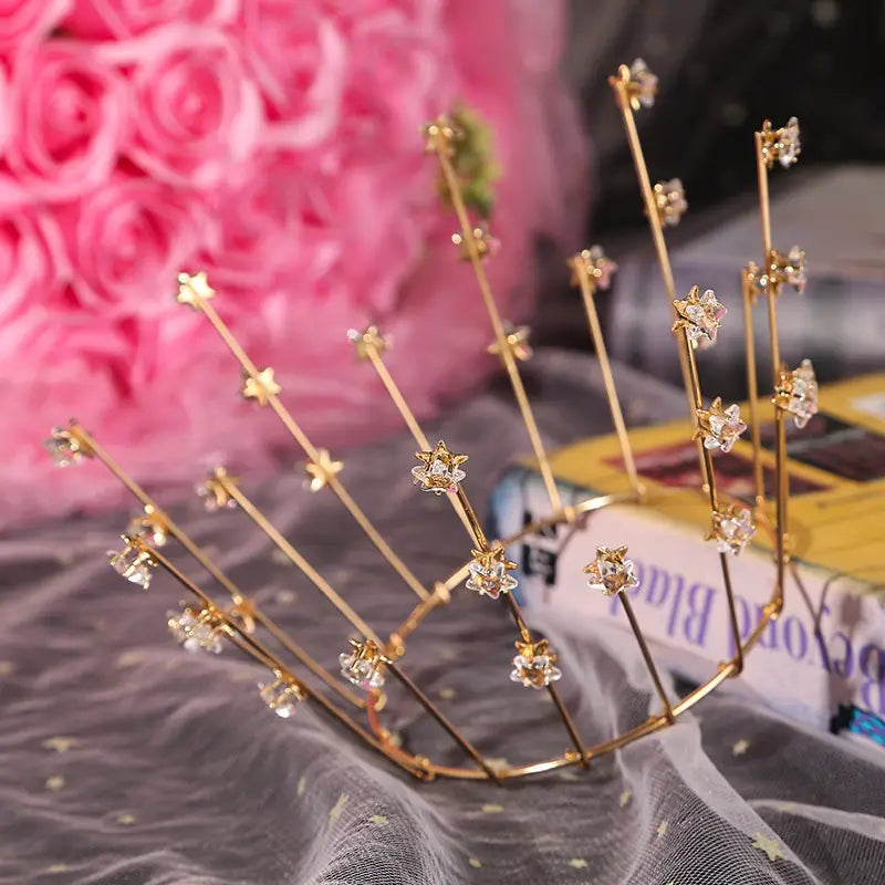 Gold-colored star tiara with clear crystal embellishments for bride wedding jewelry and wedding jewelry handmade as a jewelry handmade star crown.