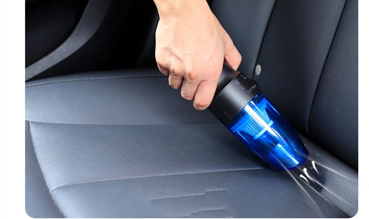 Blue handheld household mini vacuum with black handle and transparent nozzle designed as a compact vacuum cleaner for efficient home use.