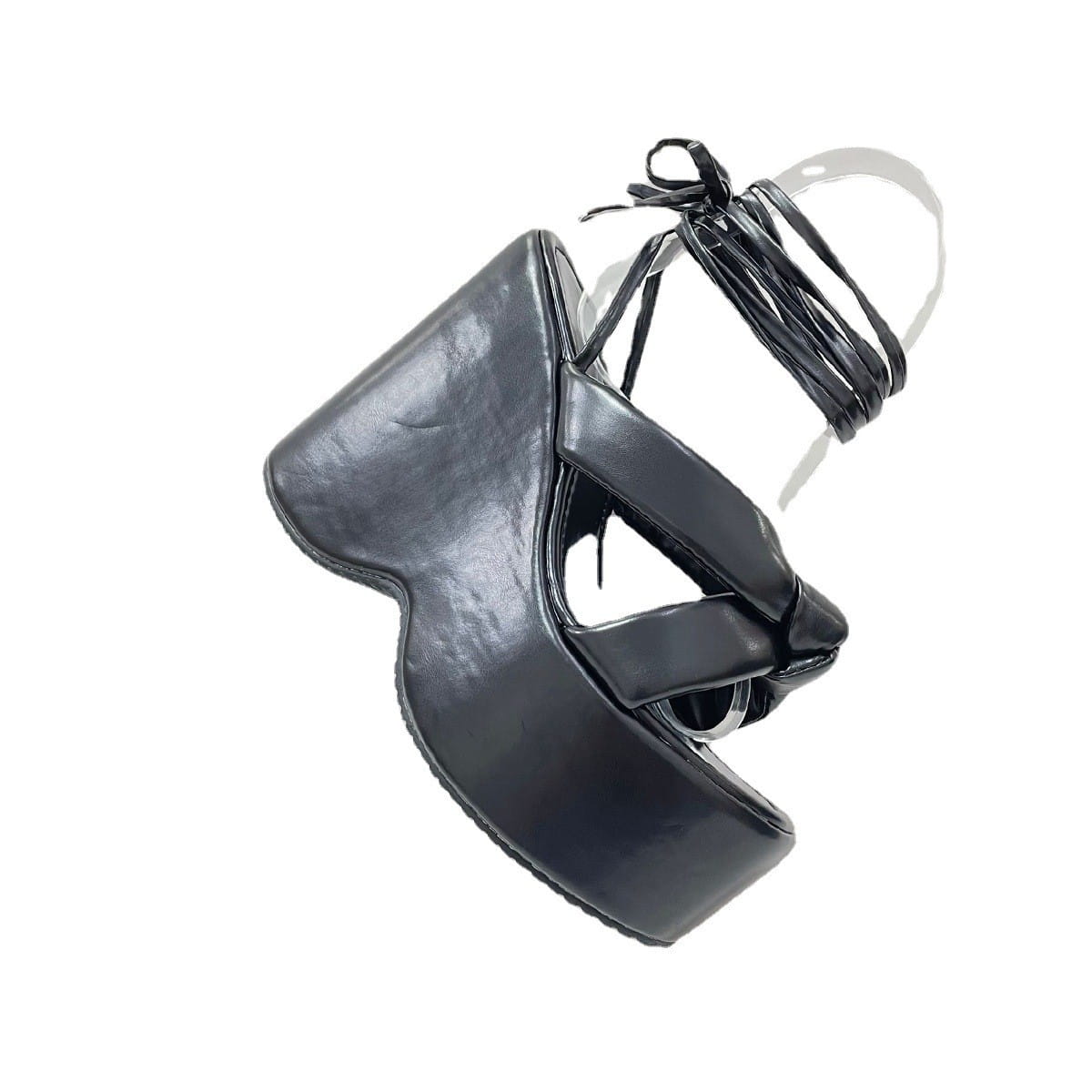 black platform wedge high sandal with glossy leather finish and crisscross lacing in a high heel platform style