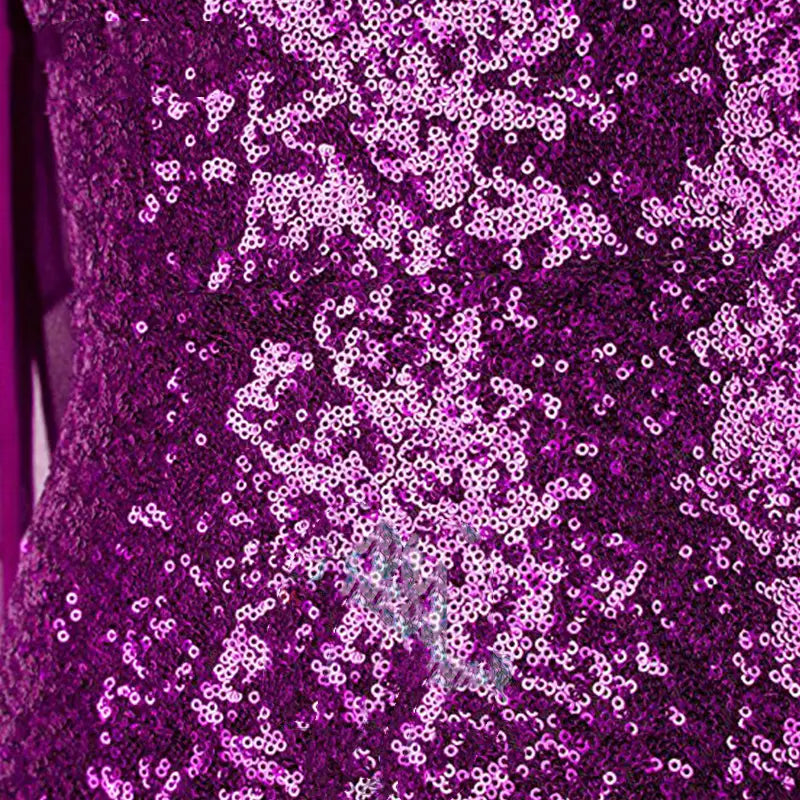 a shimmering purple sequined fabric showcasing the texture of a rose gold ombre one shoulder fishtail sequin evening dress with a slim fishtail sequin design