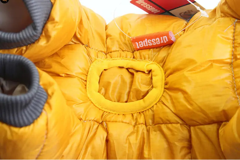 bright yellow puffer jacket with gray ribbed cuffs and elasticated waistband designed as pet dog winter clothes for warmth and comfort.