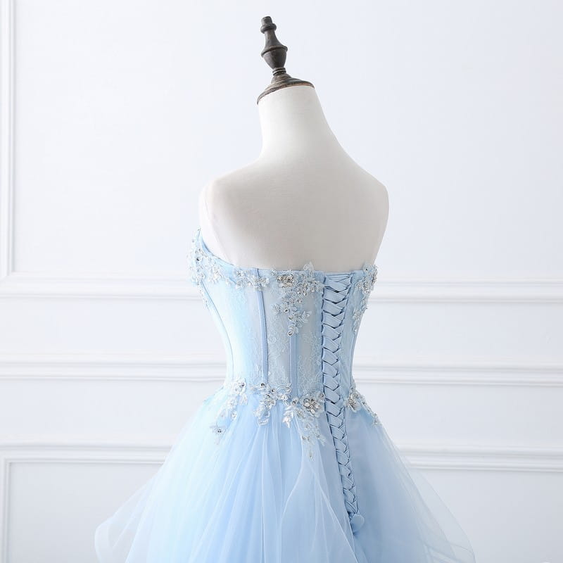 light blue slim fit bridesmaid gown with a tied slim fit corseted back featuring intricate silver beading and lace detailing suitable for an annual meeting