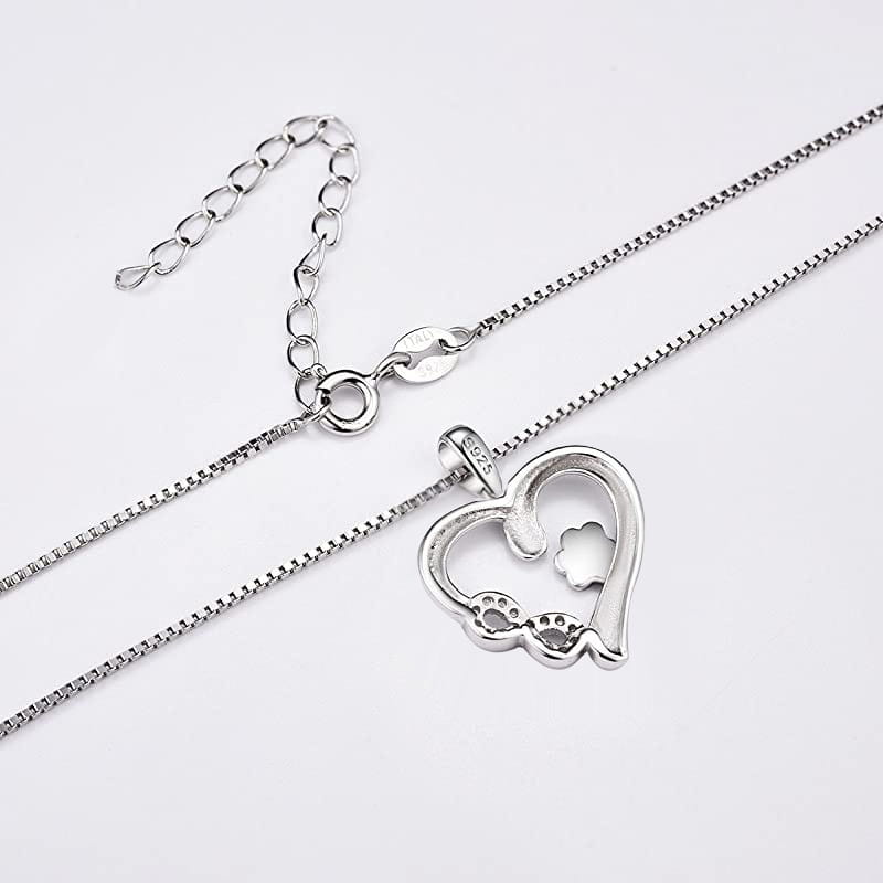 Silver heart necklace with a cutout dog silhouette and paw prints featuring a box chain design in s925 fashionable pet dog paw silver material.