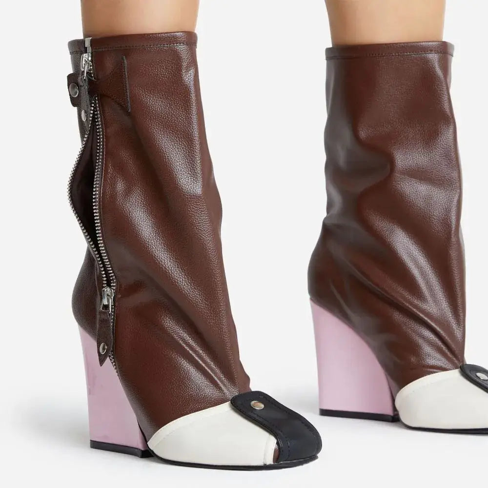 Brown leather high heel short tube boots featuring a contrasting pink wedge heel and white and black toe cap detail.