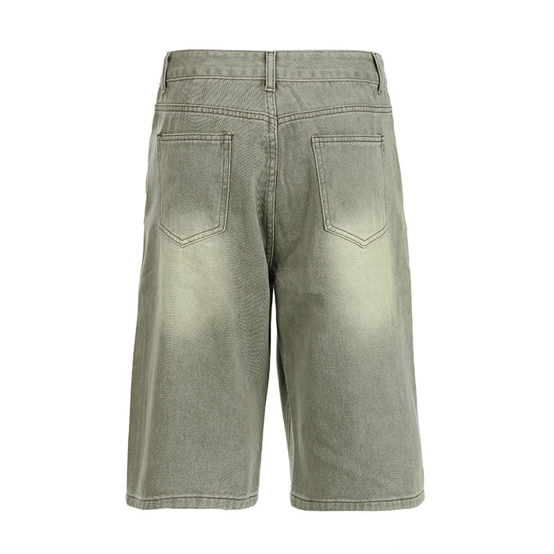 olive green denim shorts with a faded wash and two back pockets showing the back side of jeans double belt adjustable buckle shorts