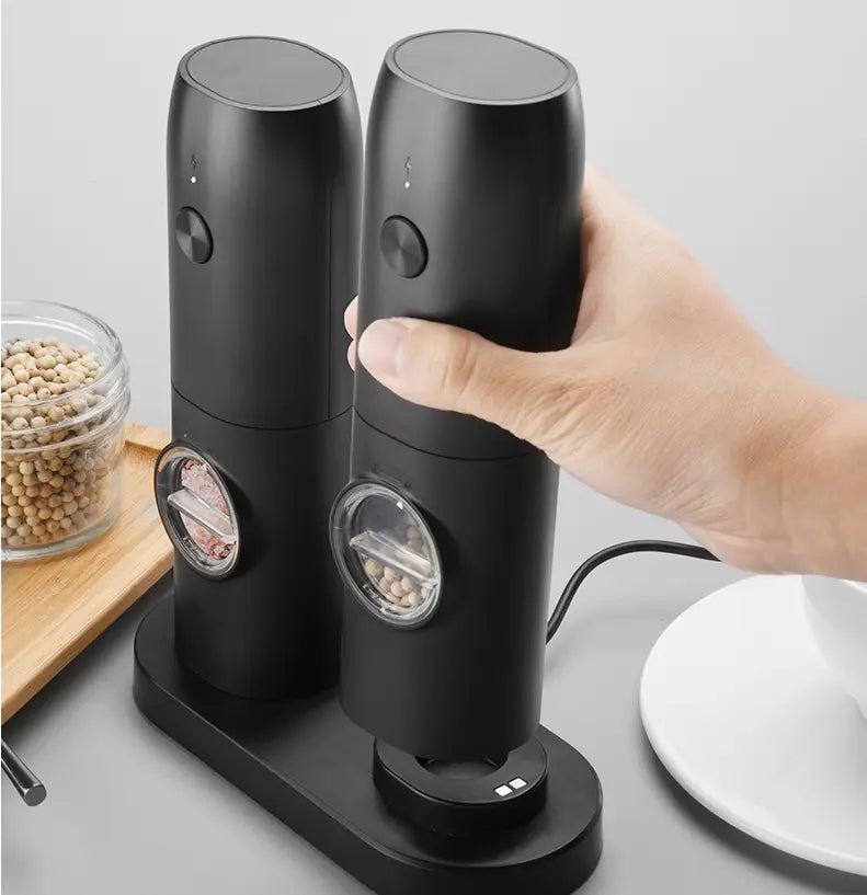 Black electric kitchen household grinder set featuring transparent viewing windows for pepper and salt in a sleek black design.