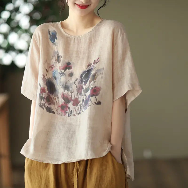 Beige linen vintage ink print t-shirt featuring a soft watercolor-style floral print in muted pinks and purples.