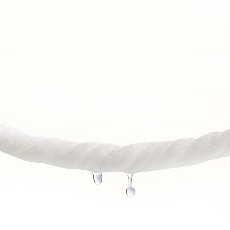 White twisted rope with two clear water droplets hanging from its end in a modern household baby wet wipes heater and dispenser highlighting moisture retention and wet wipes quantity control.