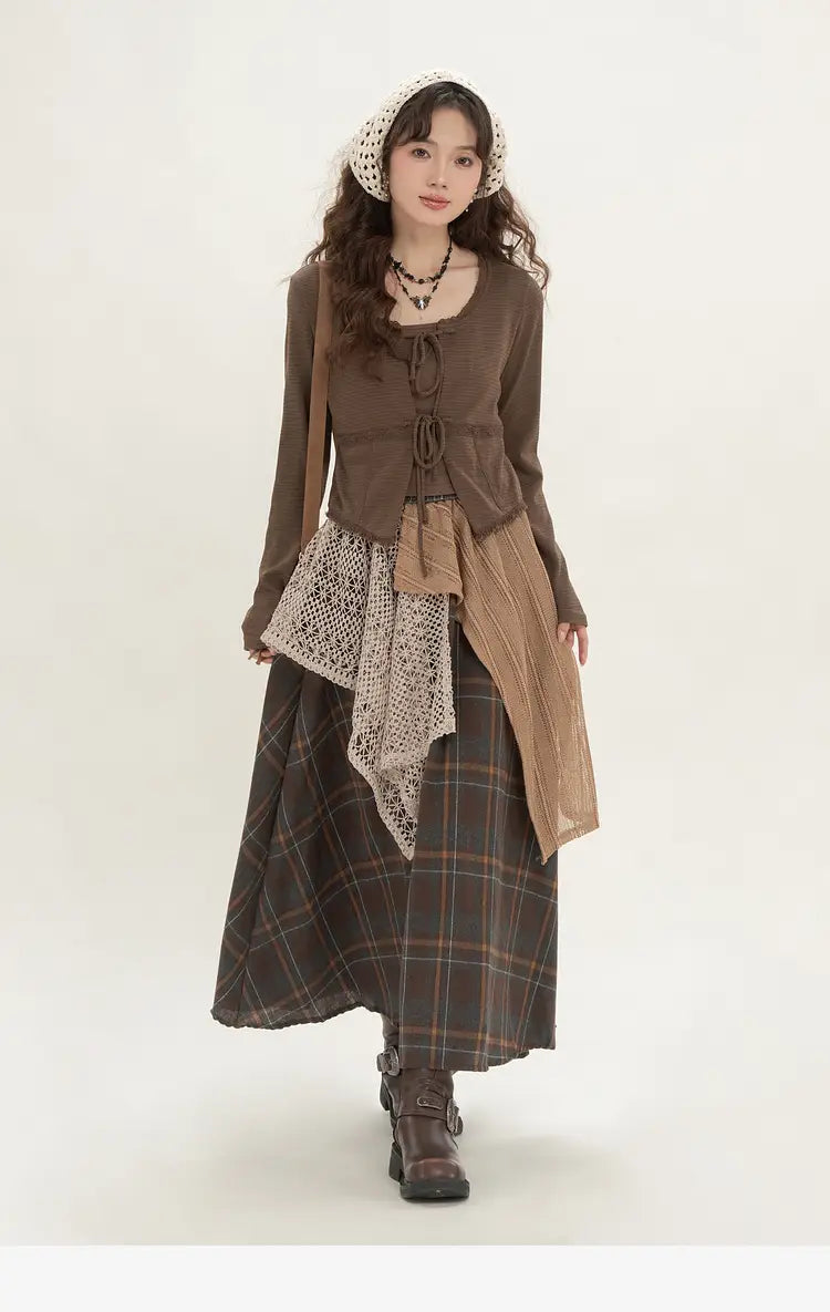 brown long-sleeved top with tie-front detail and layered textured fabric panels paired with a retro minority irregular plaid a line skirt.