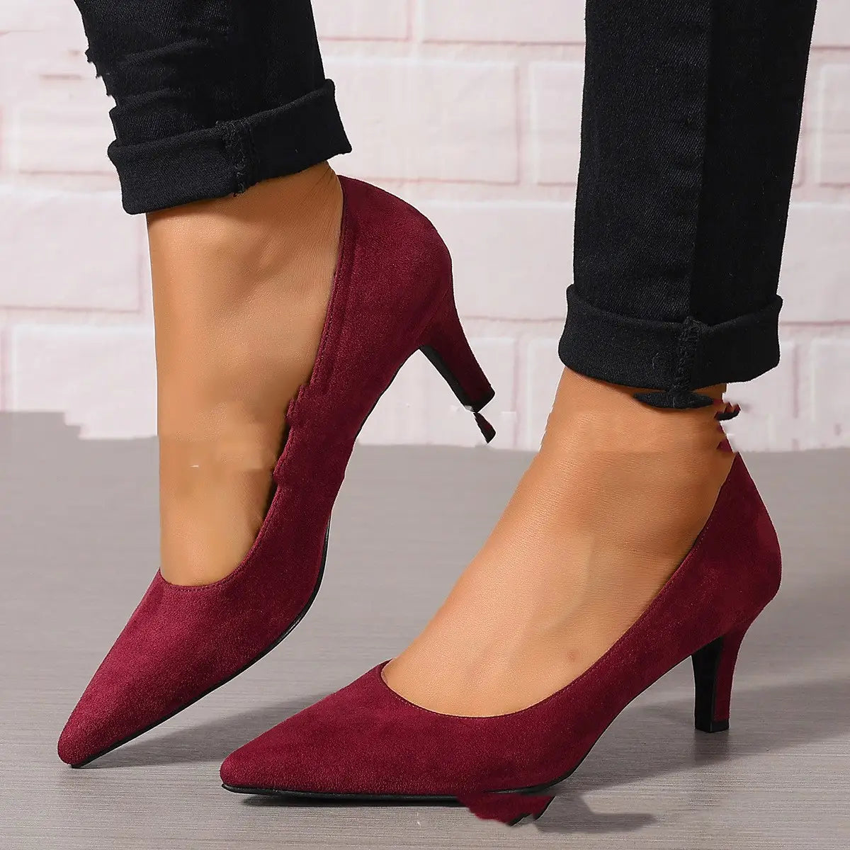 Purple suede pointed toe pumps featuring a sleek burgundy fashion ladies stiletto heel.