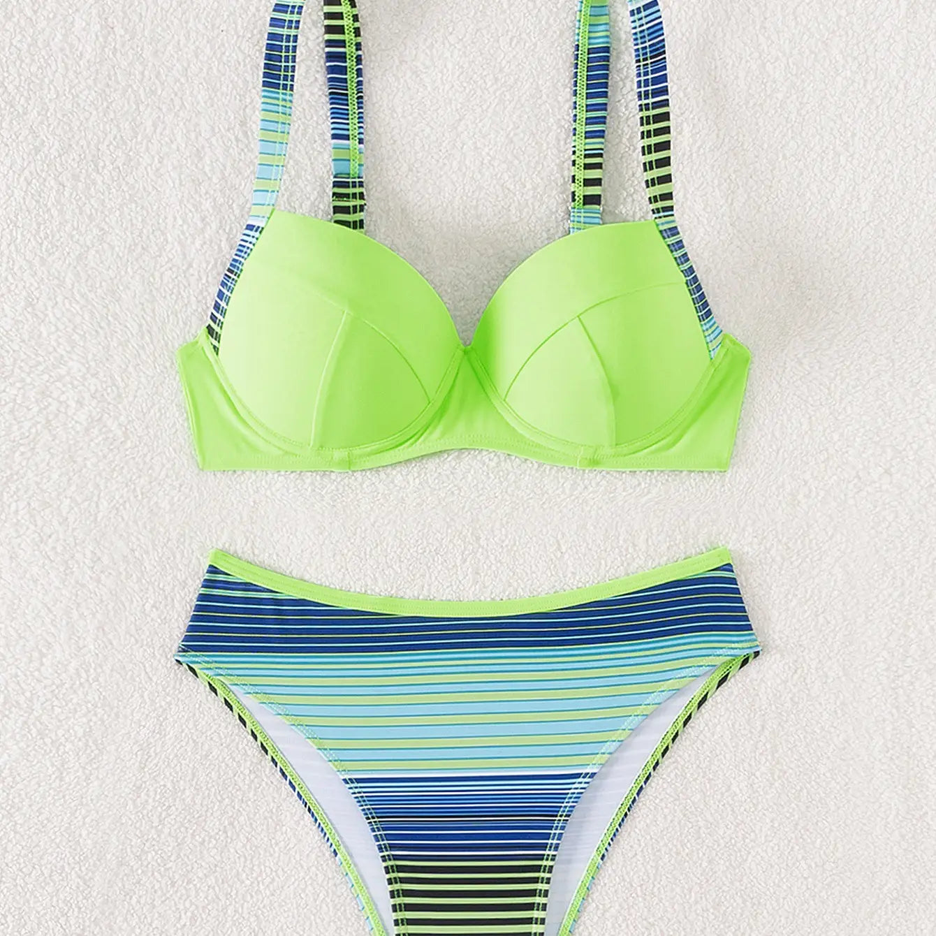 Bright neon green underwire bikini top with striped blue and lime accents from a lime green navy striped printed split bikini swimsuit.