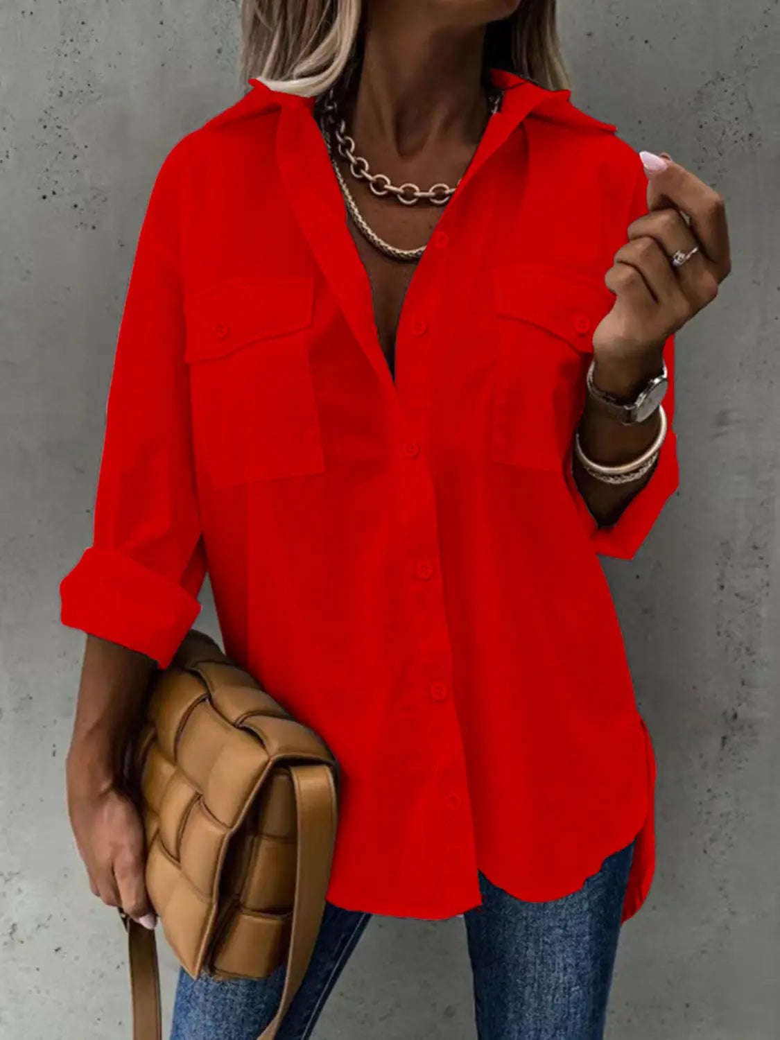 vibrant red loose long sleeve lapel button down shirt with two chest pockets and rolled sleeves made from breathable fabric