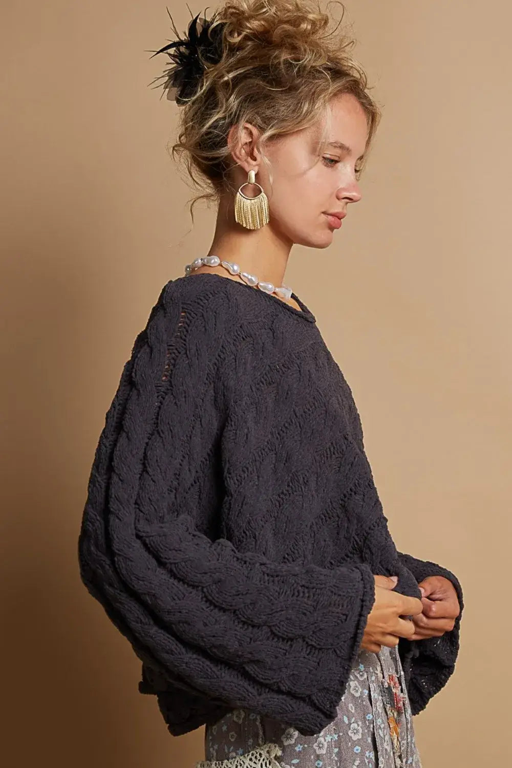 dark gray pol round neck cable knit cropped sweater with textured chunky knit pattern and long sleeves