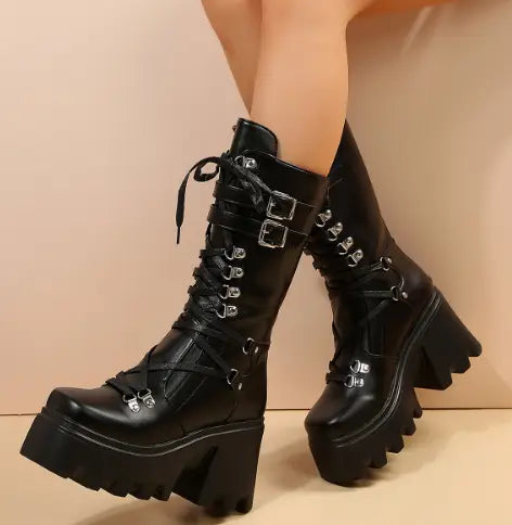 Black versatile casual leather platform boots featuring black leather combat design with silver buckles, laces, and chunky platform soles.