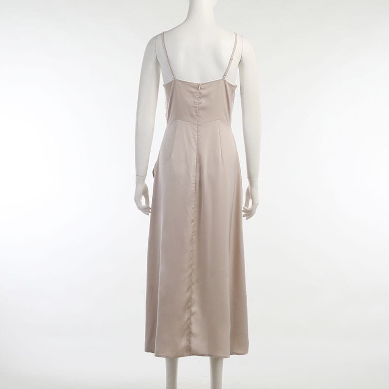 a flowing beige satin midi slit sling dress with delicate spaghetti straps and a button-down back perfect for sling dress summer fashion