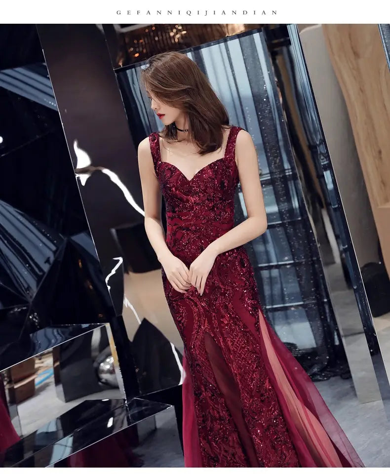 a deep red sleeveless mermaid-style fishtail long summer gown with intricate lace and sequin detailing perfect as a summer sequins sling evening dress