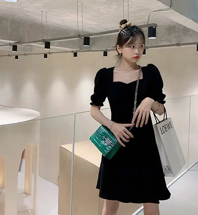black velvet dress with puffed sleeves and square neckline in a retro style satin black dress image