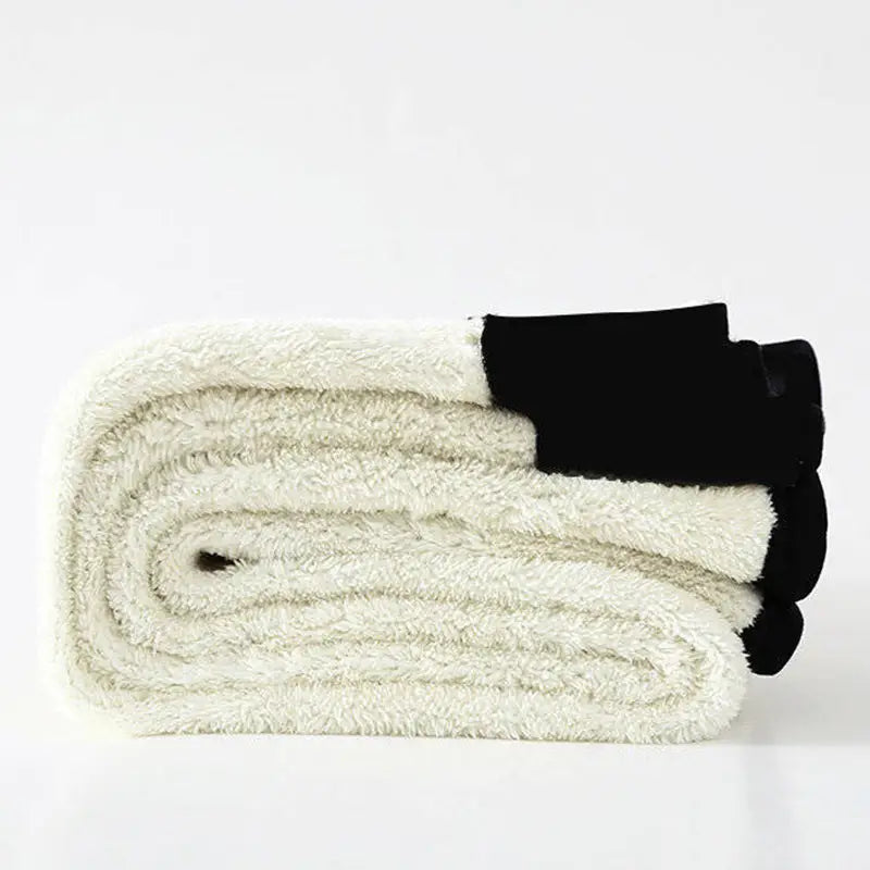 Cream-colored royale essence lux high stretch winter leggings with fleece lining and a black elastic waistband.