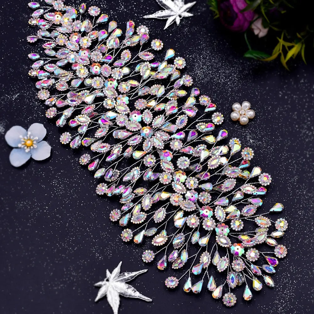 silver crystal leaf styling hair accessories featuring a shimmering iridescent crystal design with a delicate silver wire base and cascading teardrop-shaped rhinestones for elegant styling hair.