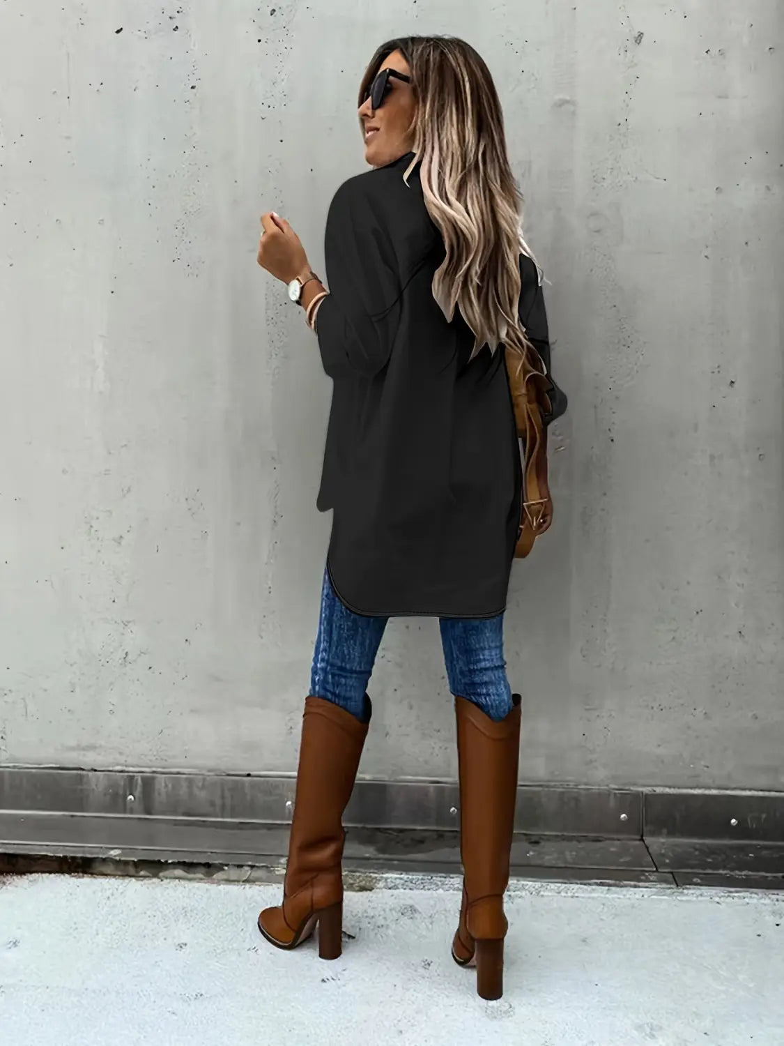 brown leather knee-high boots with block heels paired with a red loose long sleeve lapel button down shirt.