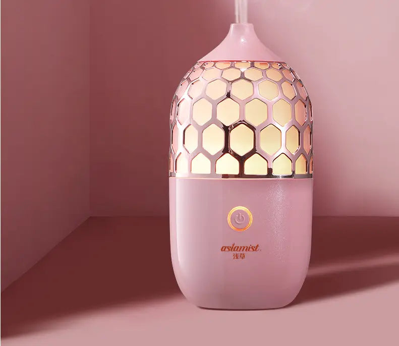 pink honeycomb-patterned ceramic asakusa pink aroma diffuser with gold accented top and base
