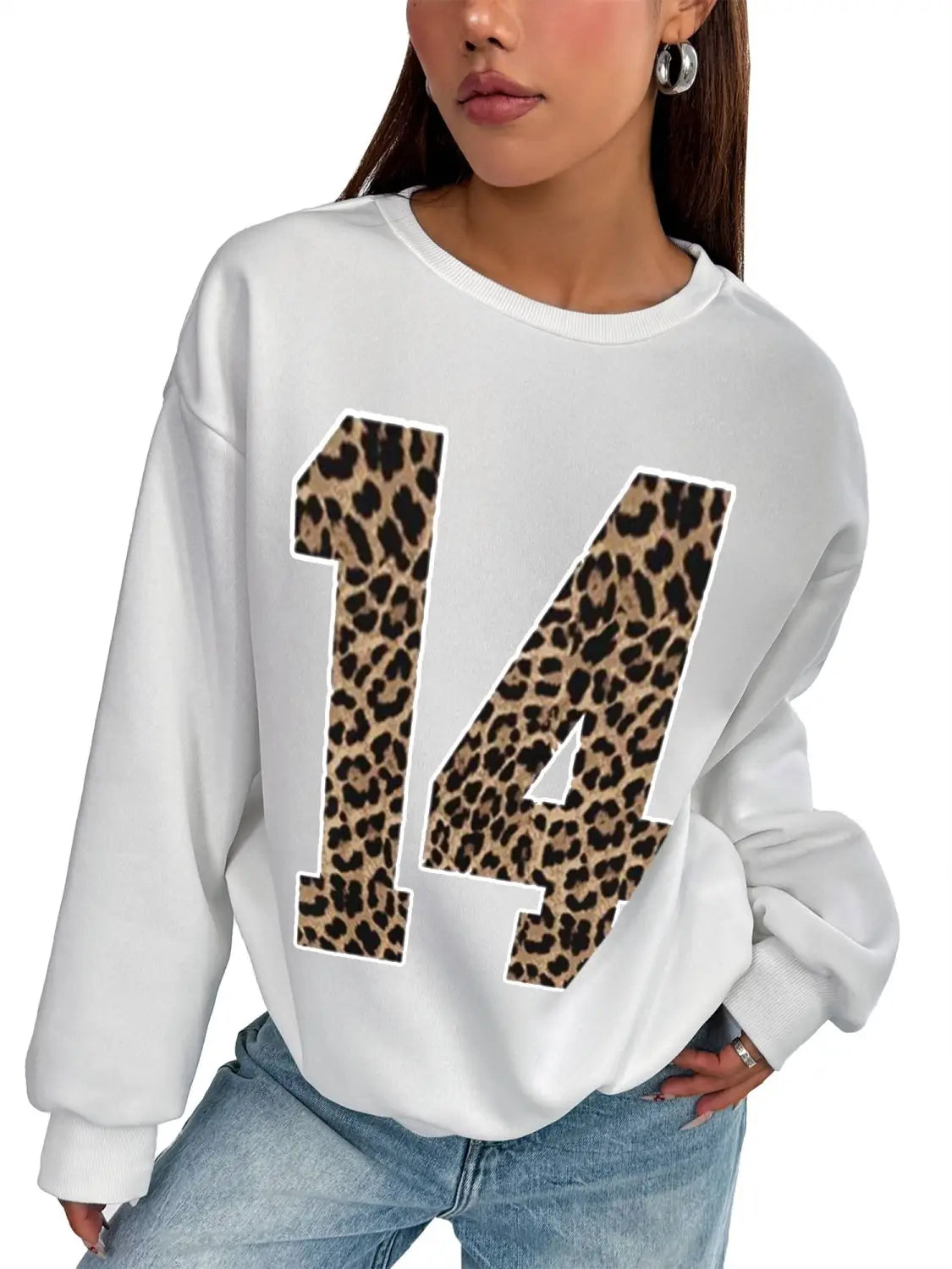White crew neck sweatshirt featuring a bold black leopard-print number 14 on the front.