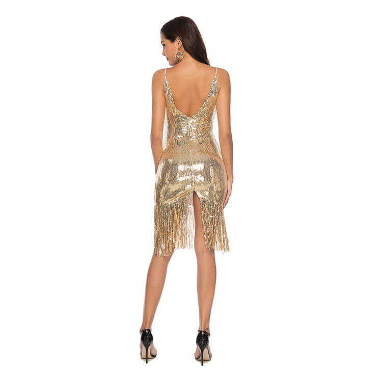 a shimmering gold sequined fringed backless slip dress shown from the back with a deep v-back and fringe detailing along the hem