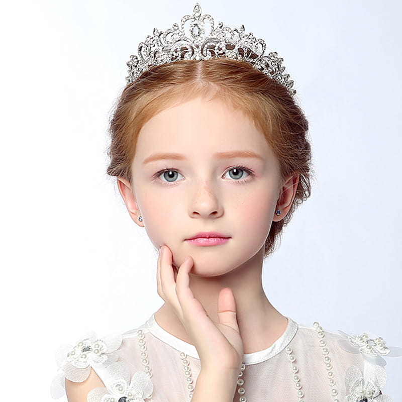 a sparkling silver crystal stage flower girl head tiara with intricate filigree and delicate crystal details