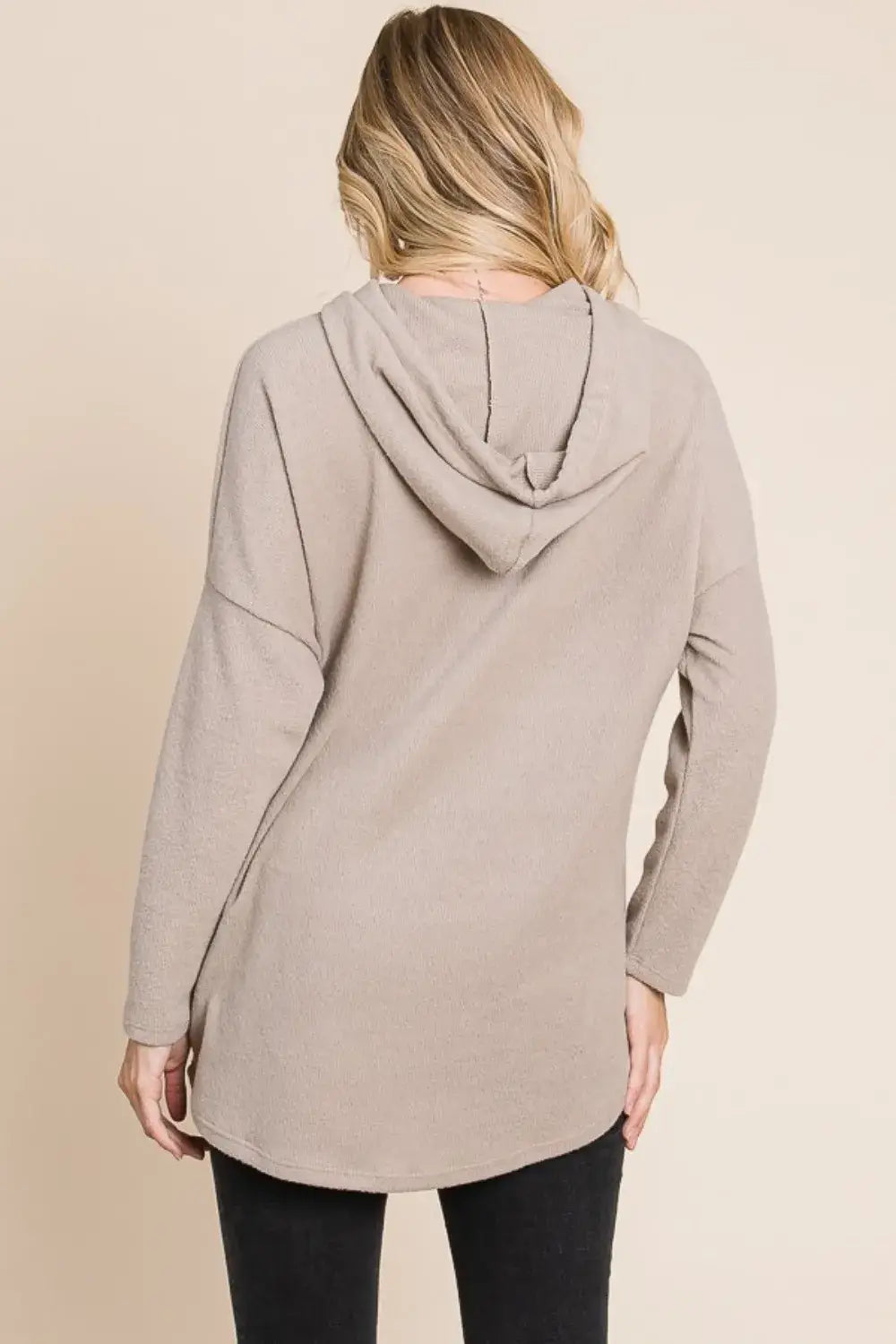 beige knit hoodie with bombom contrast drawstring featuring a relaxed flowing silhouette and long sleeves