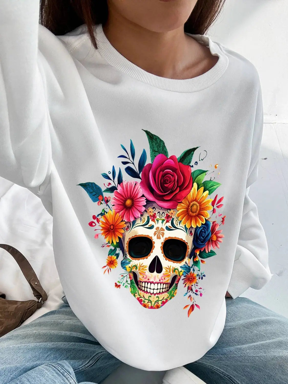 White basic long sleeve crew neck sweatshirt featuring a vibrant colorful floral sugar skull design for daily wear