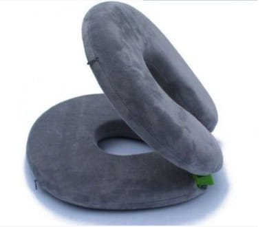 gray memory foam foldable travel pillow with circular donut-shaped design for comfortable foldable travel seating