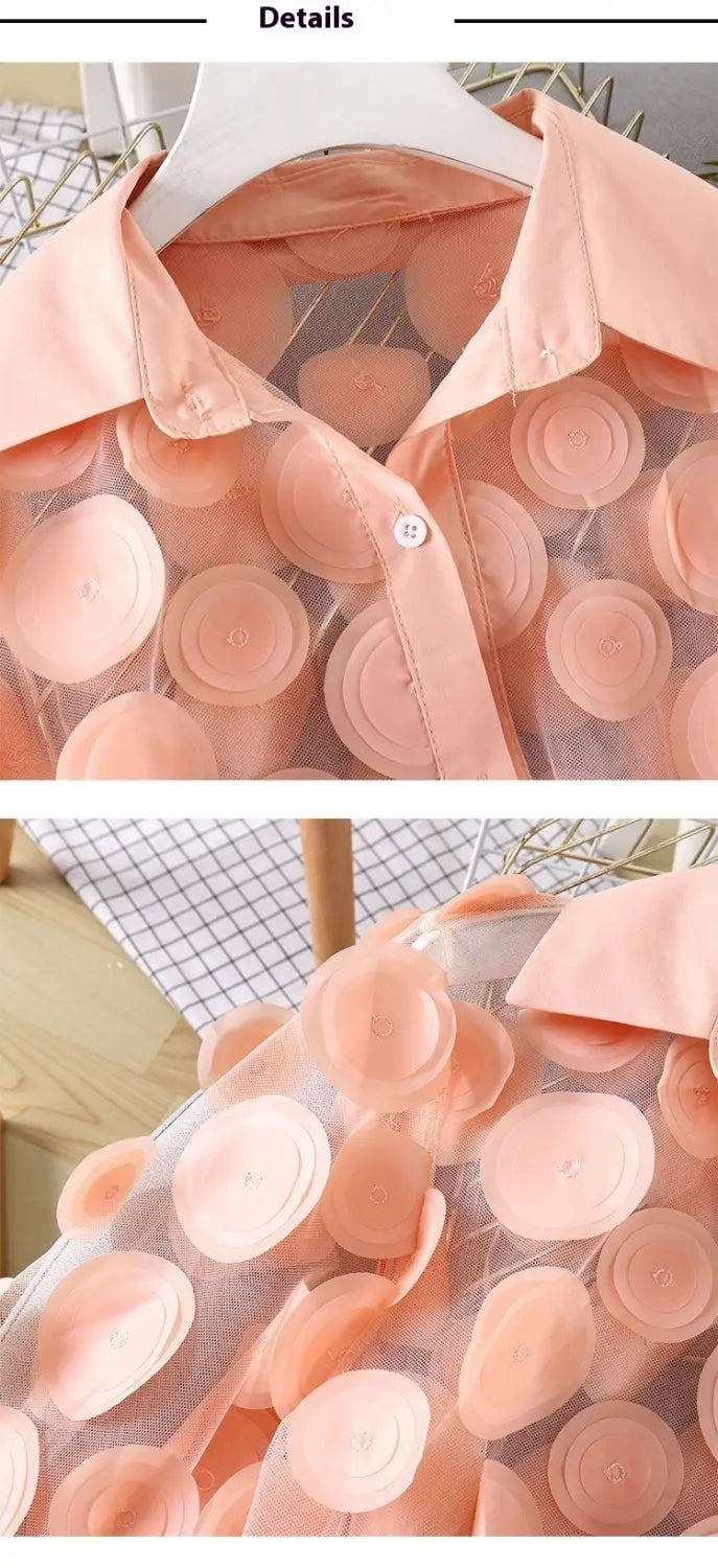 A delicate peach-colored chiffon gauzy shirt featuring layered circular appliqués resembling soft fabric rosettes in a 3D flower chiffon gauzy design.