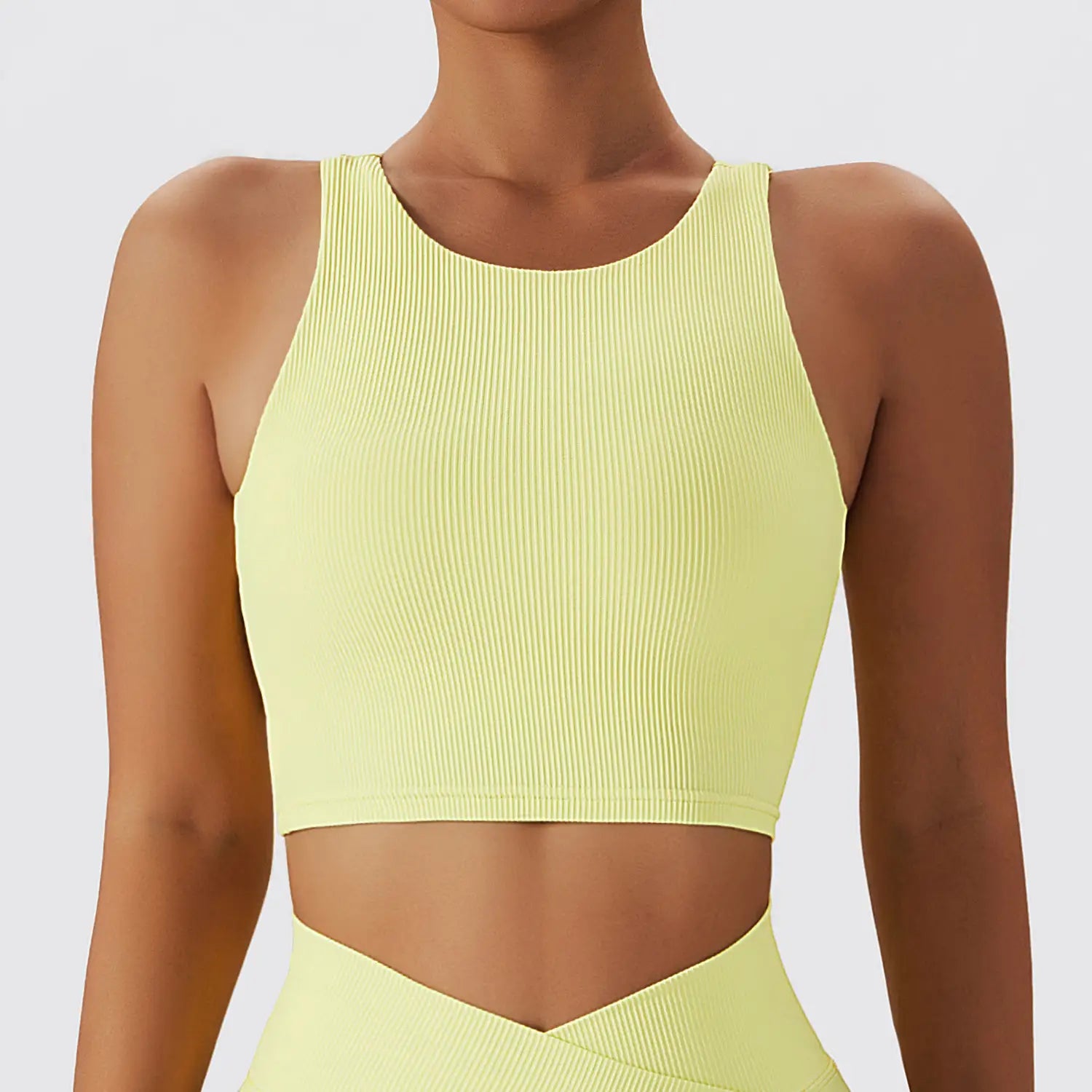 a vibrant lime green ribbed running sports bra with a quick dry breathable fabric and sleek form fitting design for running sports activities