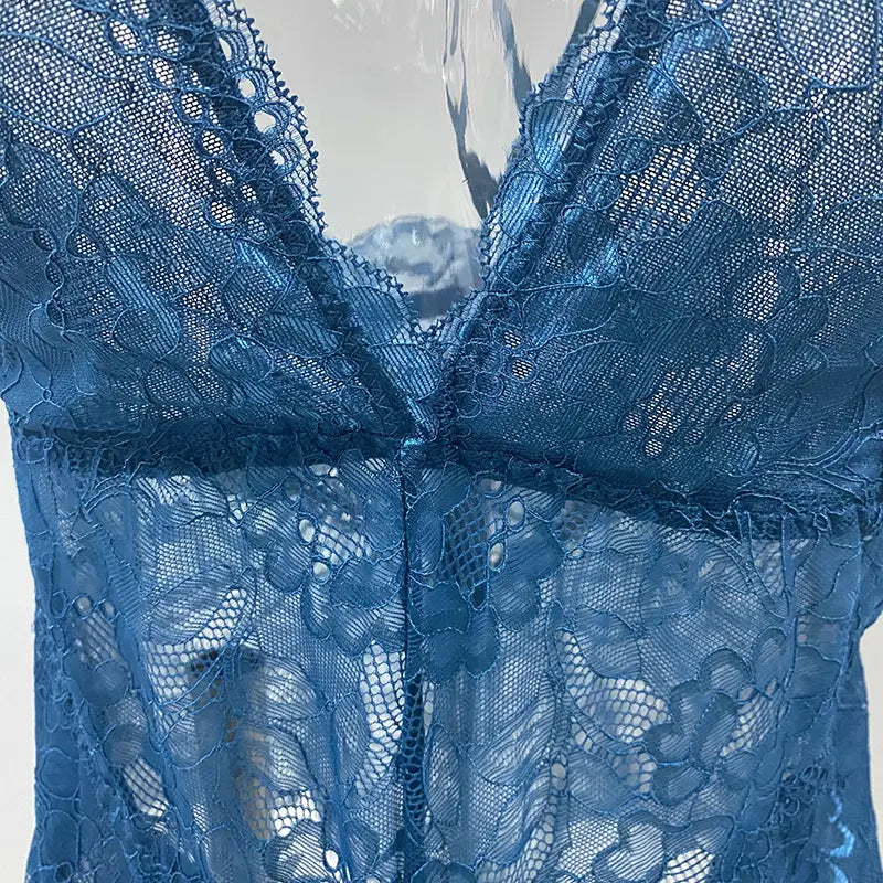A delicate blue lace sleeveless halter plus size bodysuit featuring intricate floral patterns and a deep v-neckline.