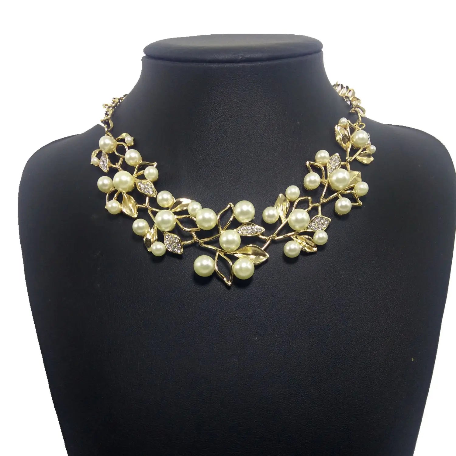 gold-toned clover necklace jewelry featuring an intricate design of pearl-like beads and leaf motifs accented with sparkling rhinestones as necklace jewelry accessories and jewelry accessories earrings.