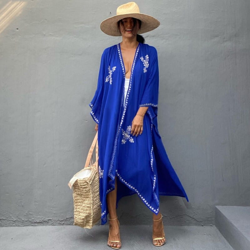 Vibrant royal blue rayon embroidered holiday sun cardigan featuring white cross-like patterns and beaded trim for holiday sun protection.