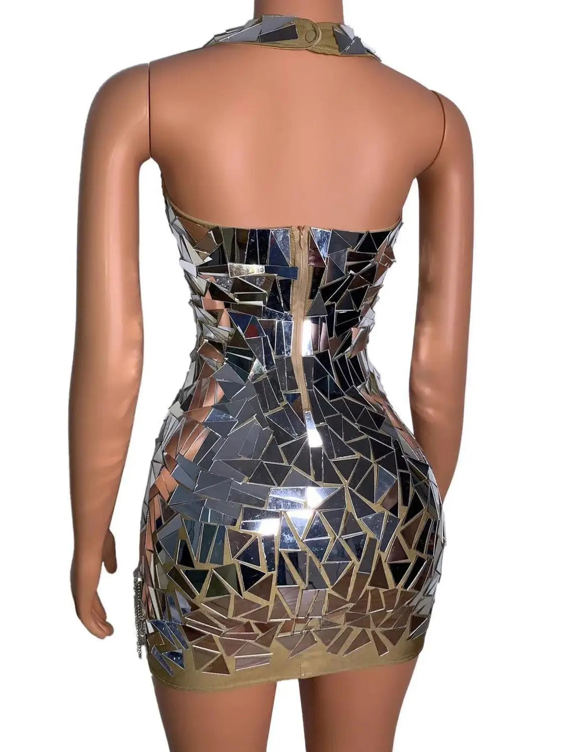 A shimmering, form-fitting mini dress adorned with a mosaic of reflective silver and gold mirror shards designed for nightclub dj female and stage nightclub performances.
