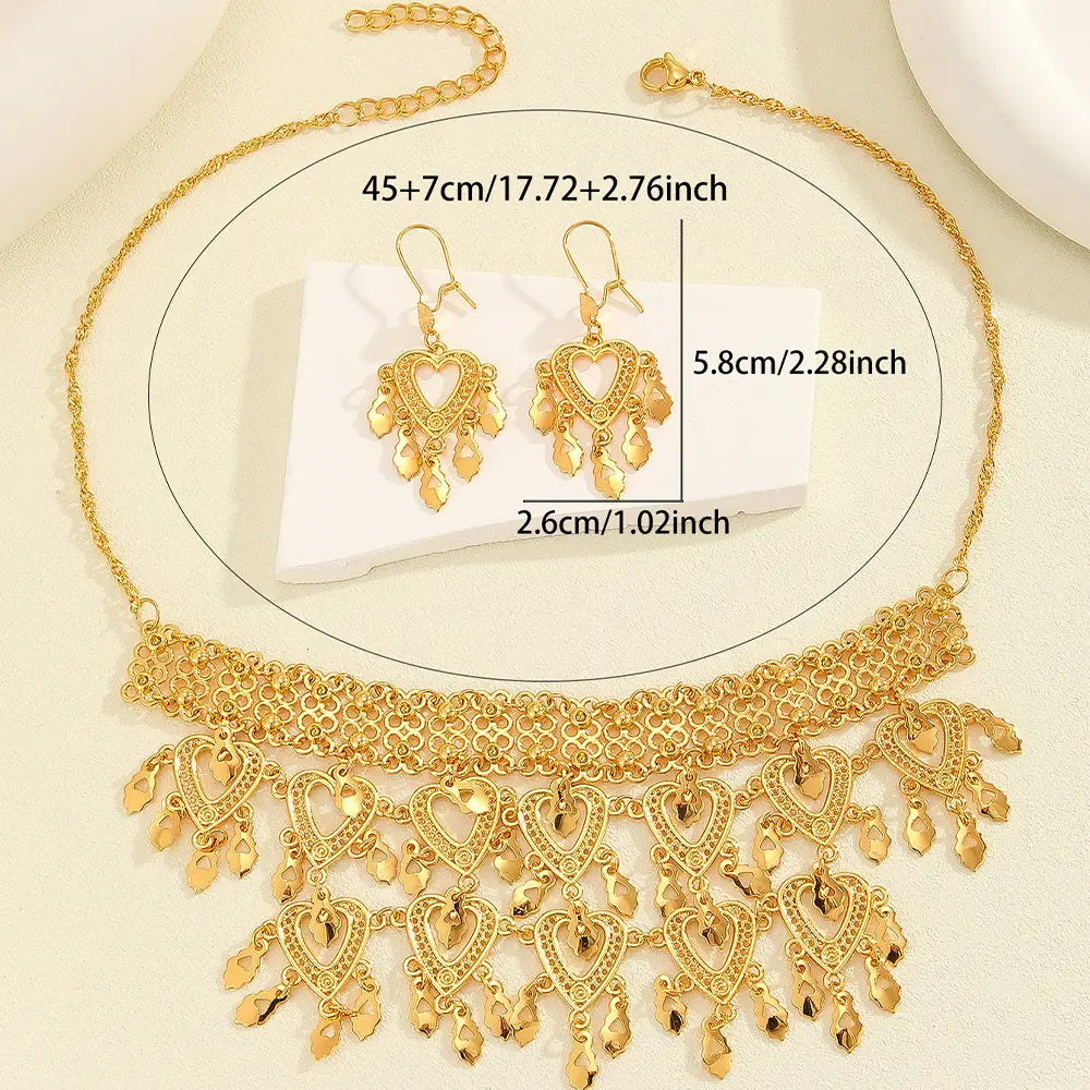 Gold-colored 3pcs fashionable retro luxury hollow necklace earrings set featuring an intricately designed choker with dangling heart-shaped pendants and matching earrings.