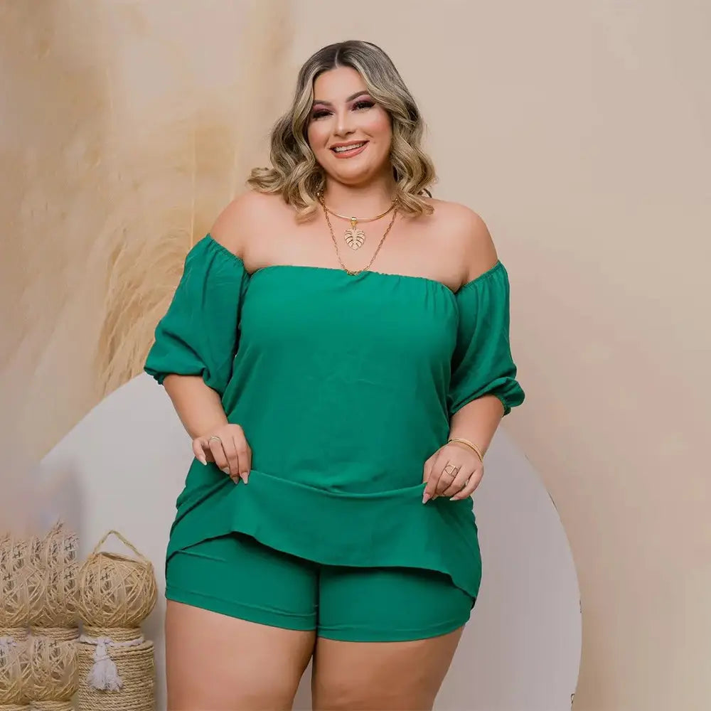 plus size ladies emerald lace up two piece set featuring an off-the-shoulder top with puffed sleeves and comfort stretch shorts in emerald green lace