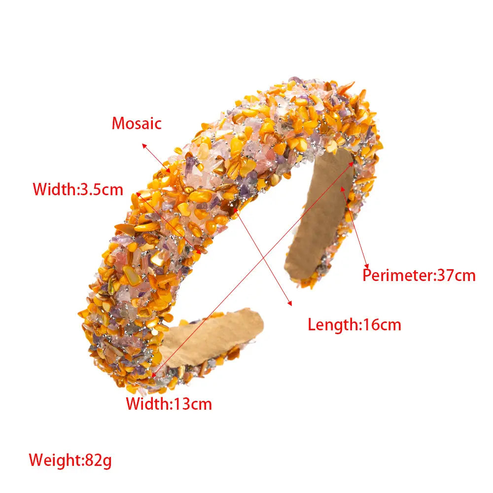 a baroque colorful headband featuring a vibrant mosaic cuff bracelet adorned with sparkling amber gold and pinkish crystal fragments