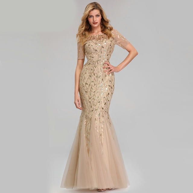 Beige temperament mermaid dress featuring gold leaf embroidery and sheer short sleeves in a mermaid gown design.