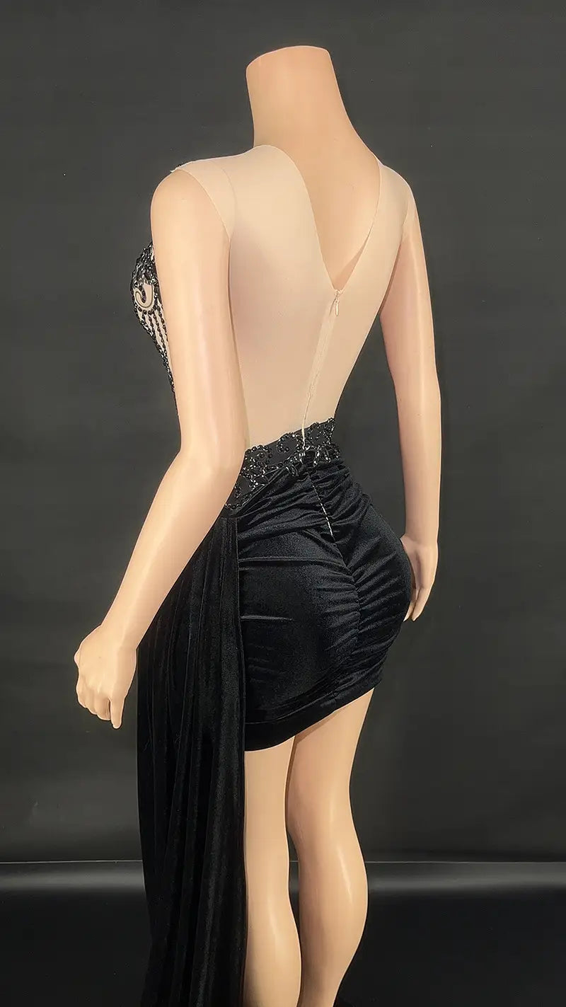 Black velvet luxury evening dress in mini length with sheer back and beaded embellishment showcasing elegant summer luxury evening wear for female events.
