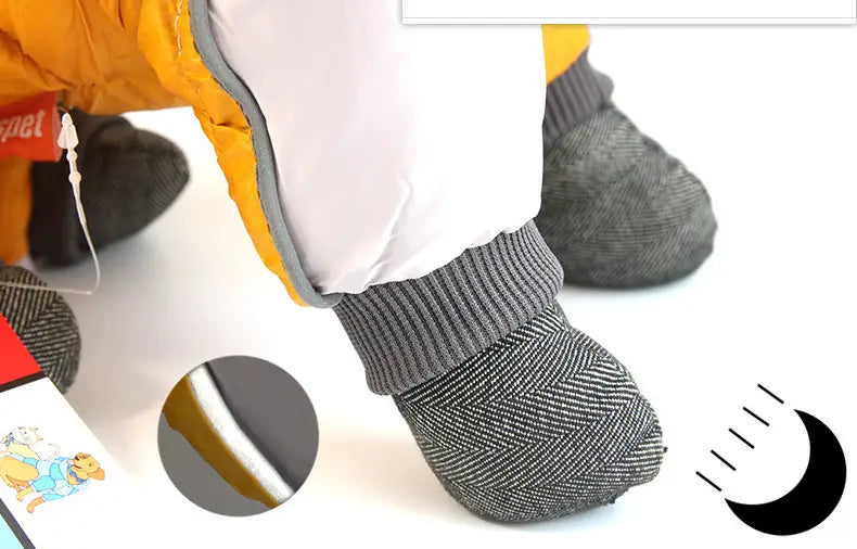 gray herringbone-patterned dog booties with a ribbed cuff and white inner lining complement quilted orange and white pet dog winter clothes for cold weather protection.