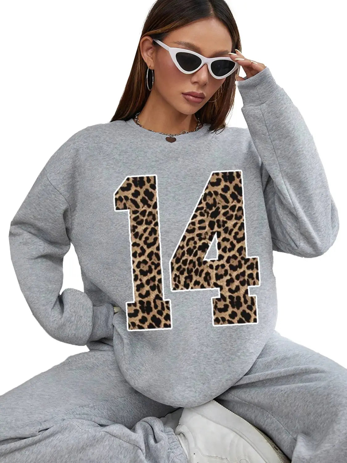 gray crew neck sweatshirt featuring a bold black leopard print number 14 on the front
