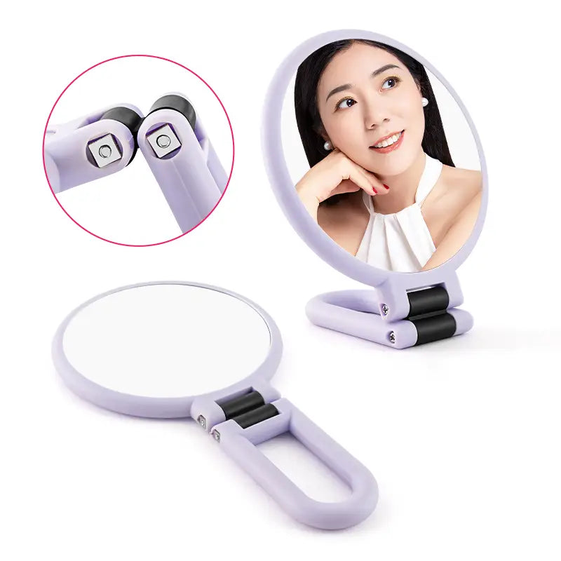 Lavender-colored foldable handle mirror purple with 10x magnification features a sleek ergonomic design and black rubberized joints for enhanced durability.