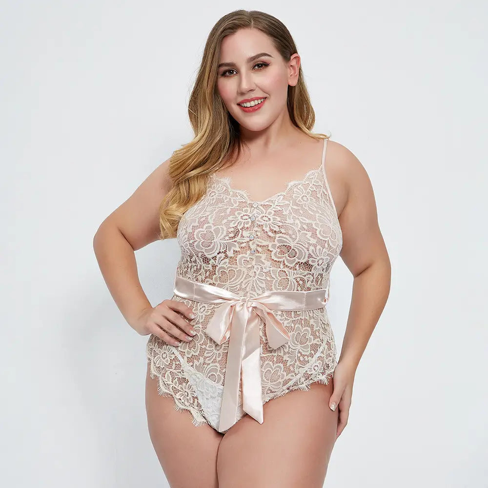 a delicate beige oversized lace lace bodysuit made of lace with a satin ribbon belt tied in a bow at the waist