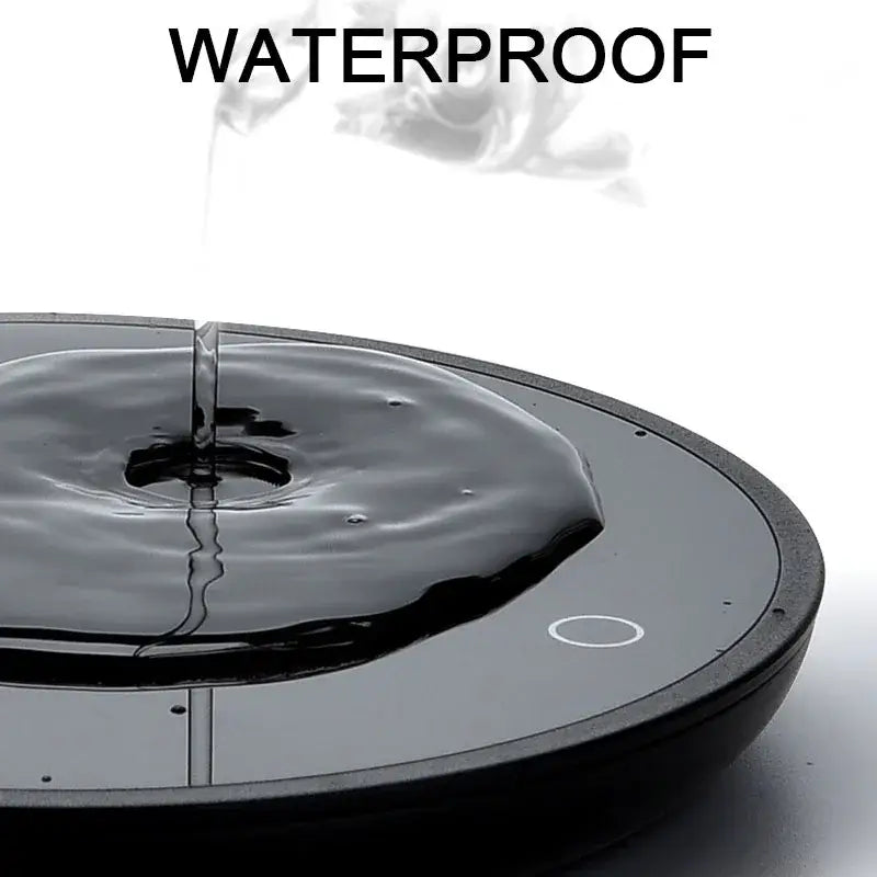 black circular waterproof mug cup warmer with a sleek glossy finish and subtle white accent ring designed for tea and coffee cups