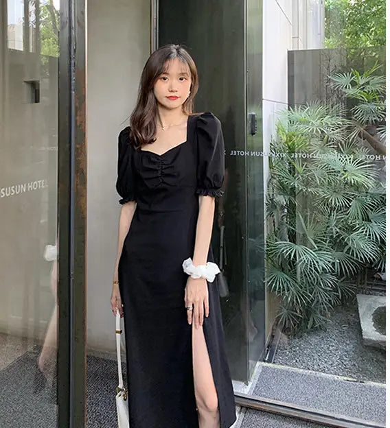 a black satin dress image featuring a retro v neck design with puffed sleeves and a high slit showcasing an elegant black dress for formal occasions