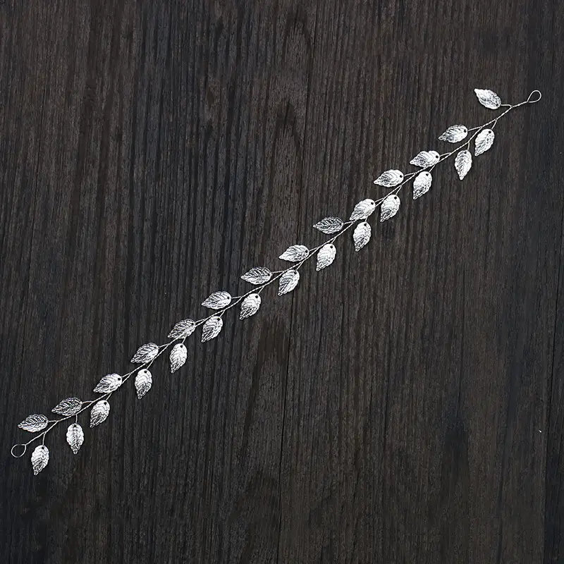silver leaf hair band featuring a slender wire design with delicate and intricately crafted silver leaves